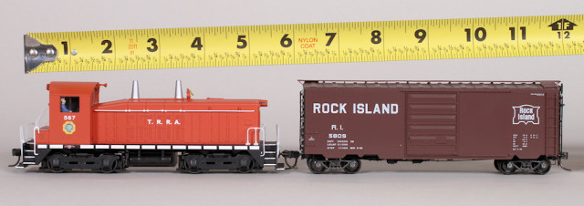 An HO scale switcher and 40' car is slightly over 12" long.