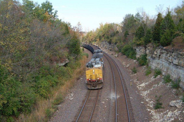 UP AC 44CW #7213 coming down grade just east of Eureka; in a matter of a couple hundred feet they will pass beneath historic Route 66 and almost immediately under I-44 on their westward journey back to the coal fields.