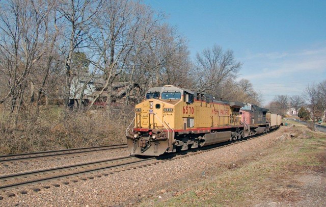 Geyer Road in Kirkwood is the location where we find a UP AC 44CW headed west with coal empties on "reverse iron"; the second unit is still in its Southern Pacific paint. This spot is just west of the Kirkwood Station.