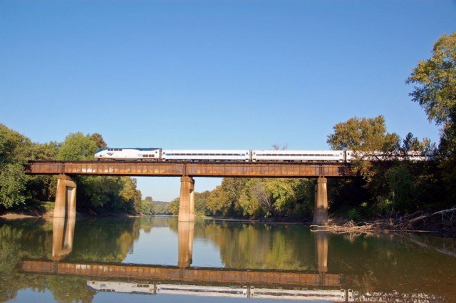 Amtrak's morning train to Kansas City crosses the Meramec River at Sherman Beach.