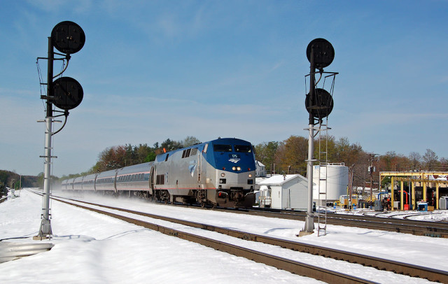 Amtrak's Pennsylvanian kicks up the snow headed east in Cresson, April 24.