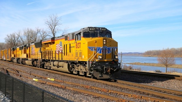 Eastbound UP at track speed at the Washington, MO, station. That's the Missouri River in the background.