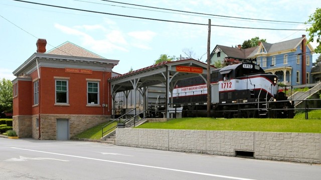 Again, we were able to get ahead of the train and catch #1712 as it passed the historic station in Roaring Springs. We are sitting in the parking lot of Roaring Springs Bottled Water, a popular brand available throughout the country.