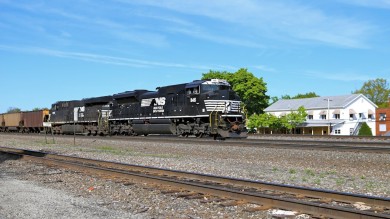 Westbound NS empty hoppers pass the Station Inn, our B&B, in the background with the red & white awnings.