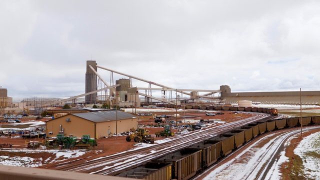 Black Thunder Coal Mine, owned by St. Louis entity Arch Coal, is the largest mine (by production) in the world. Trains never stop in the loading process; 100-plus car trains enter the facility empty and keep moving through the flood loaders and depart full. Here, the train headed towards us has come through the loader and is outbound; empties in the foreground are already in the circuitous route to be loaded in a never-ended process. Nearby sits Antelope Mine, owned by St. Louis company Peabody Coal. Coal mining and transportation is in a state of depression currently; four or five years ago, this area would see over 100 trains daily. That number is down by two thirds. Still fascinating for the railroad fan.