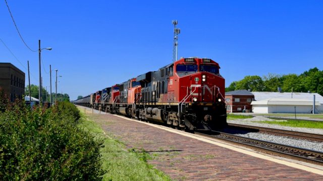 Now it’s CN’s turn. This oil train is headed toward Chicago at track speed. I’m standing on the platform at the Amtrak station for these first two shots.