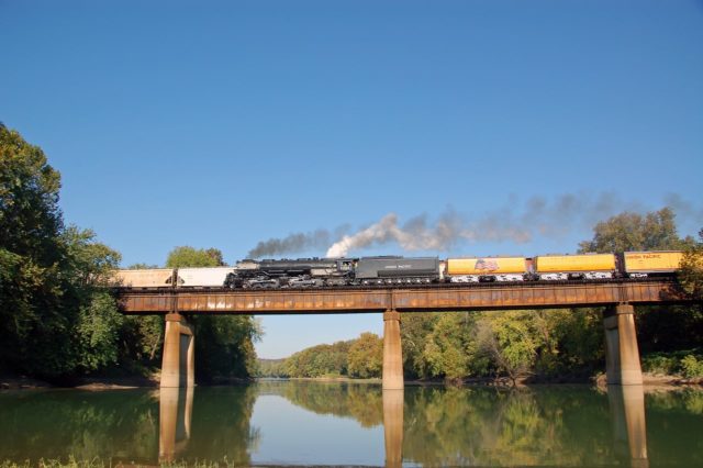 UP’s classic Challenger 3985 returns to Wyoming, crossing the Meramec River at Sherman Beach just east of Eureka, Missouri.